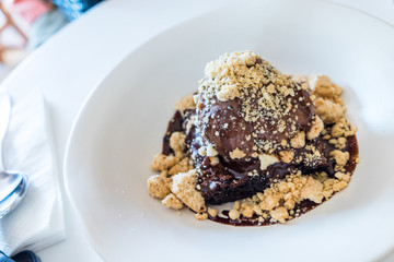 Brownie topped with chocolate ice-cream