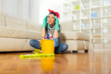 Woman with cleaning supplies