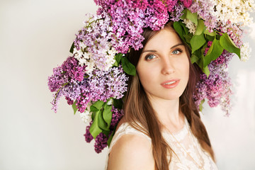 Beautiful tender brunette in big lilac crown