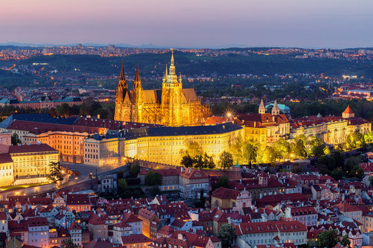 View of Prague Castle with St. Vitus Cathedral from Petrin Tower at blue hour, Czech Republic