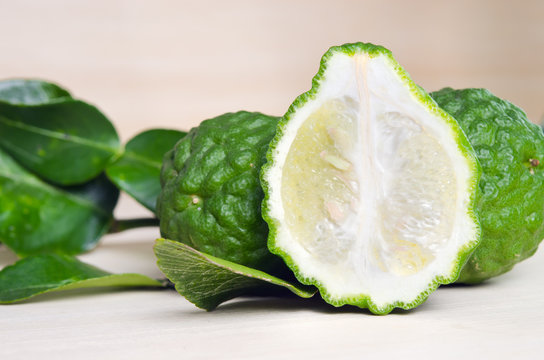 Bergamots fruit with leaf on wooden board