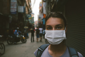 Young tourist girl with mask