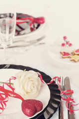 Holiday romantic table setting with pink roses