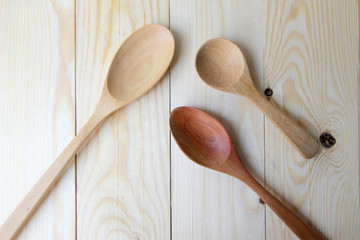 wooden spoon on table background