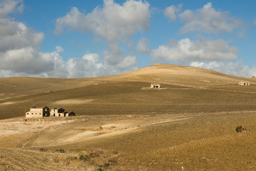 Fototapeta na wymiar Sicilian countryside, plowed field - Trapani province. Landscape of the region near Segesta, Sicily - southern Italy