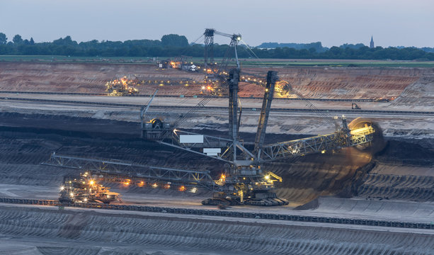 excavator int the evening open cast mining garzweiler germany