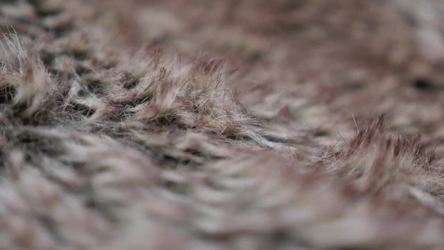 Tilting over shallow DOF fake fur fabric texture 4K 2160p 30fps UltraHD footage - Deep bokeh of synthetic fibers of fun or faux fur 4K 3840X2160 UHD slow tilt video