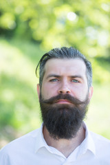 Fototapeta premium Bearded man on blue sky