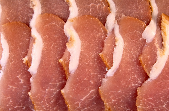 Slices of pork balyk (baked pork flesh)
