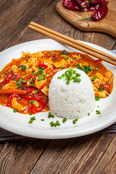 Chinese chicken with vegetables and rice.