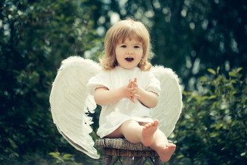 Little angel claps his hands