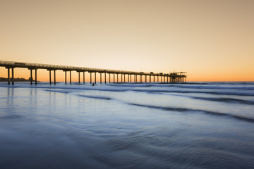Wide angle shot of Scripps Pier with reflection during sunset in La Jolla, San Diego, California - obrazy, fototapety, plakaty