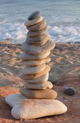 Balanced stones on a pebble beach