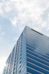 Obraz na płótnie Canvas Glass building with blue sky