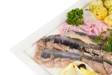 marinated herring with onion and balls of potato