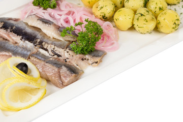 marinated herring with onion and balls of potato