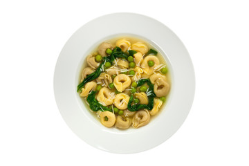 Spinach Tortellini Soup Isolated on white background. Selective focus.