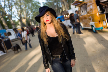 Fototapeta premium Beautiful young woman posing in the street.