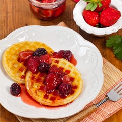 Waffles with Fresh Strawberry Syrup. Selective focus.