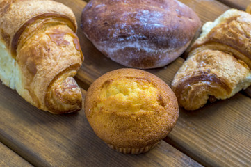 Muffins, muffins, croissants, closeup, delicious pastries