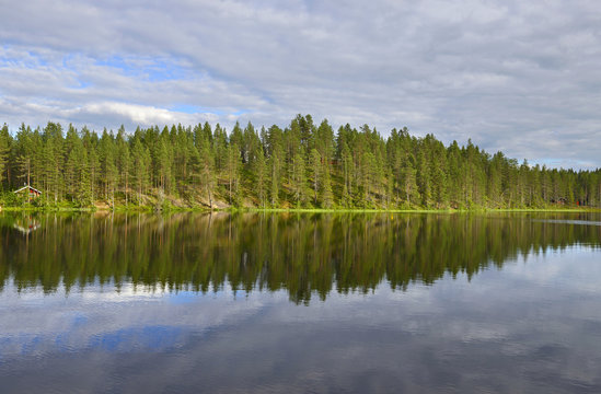 Northern landscape with a lake. Reflection © valeriyap