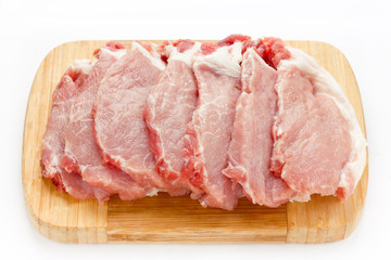 Raw meat pork steaks isolated on white background