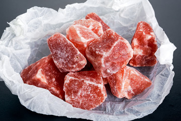Himalayan pink crystal salt on crumpled paper