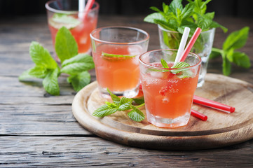 Fresh alcohol cocktail with rum, berry and mint