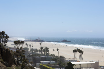Amusement Park on the Pacific ocean, the beach landscape. The ocean, beach and blue sky in USA, Santa Monica. 