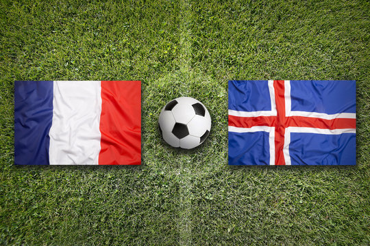 France vs. Iceland flags on soccer field
