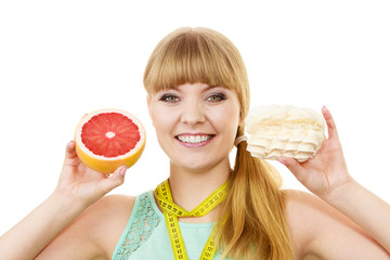Woman choosing fruit or cake make dietary choice