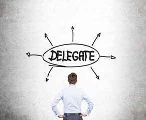 Businessman looking at delegate sketch