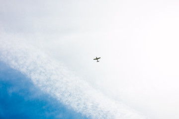 Small Plane Blue Sky and White Clouds
