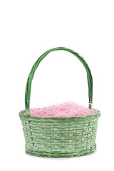 Fototapeta na wymiar green basket and pink shredded papers.