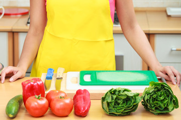Woman preparing fresh vegetables food salad