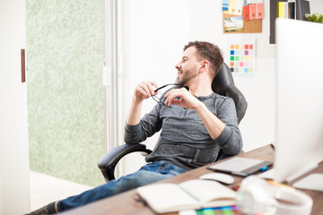 Fototapeta premium Thoughtful man taking a break from work