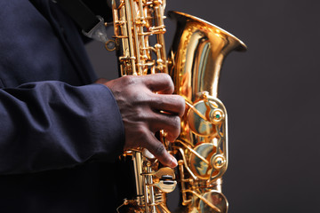 African American jazz musician playing the saxophone, closeup