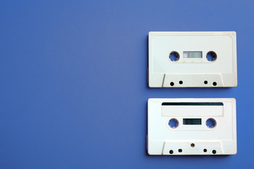 Old audio cassettes on red background