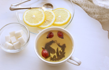 Tea set on a white wooden tray, closeup