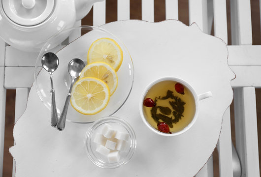 Tea set on a white wooden tray