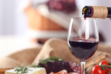 Glass of wine with food on table closeup