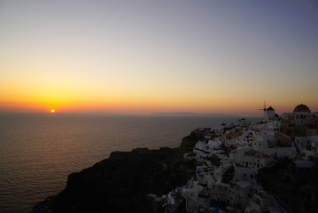 Fototapeta premium Oia village at sunset, Santorini island, Greece.