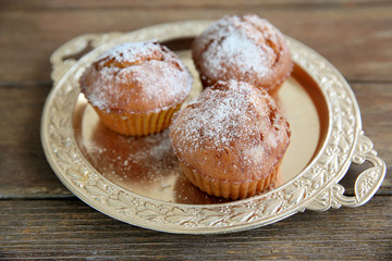 Carrot muffins  on a golden plate