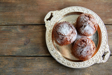 Carrot muffins  on a golden plate
