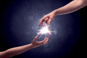 Hands reaching to light a spark