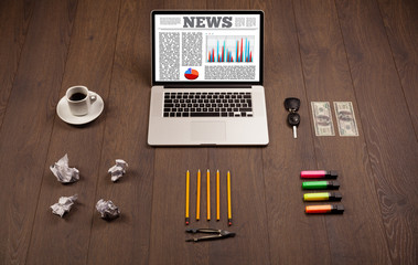 Computer laptop on desk with office accessories