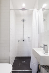 Small renovated white ensuite with rain shower