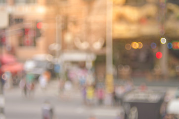 Blur people walking in street with colorful bokeh light abstract background. Travel concept.