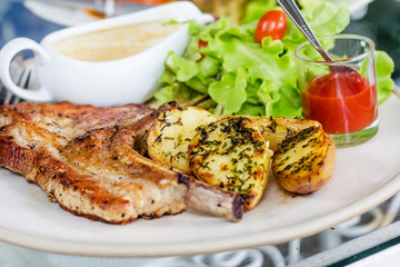 Pork chop with fried potatoes