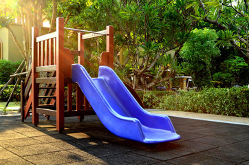 Blue slider under sunlight - children playground